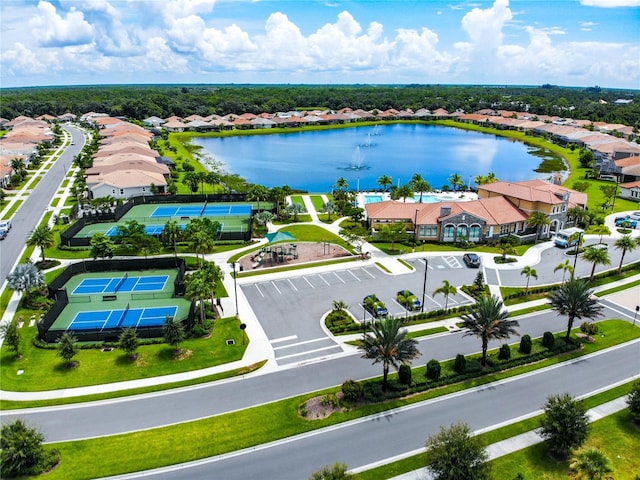 bird's eye view with a water view and a residential view