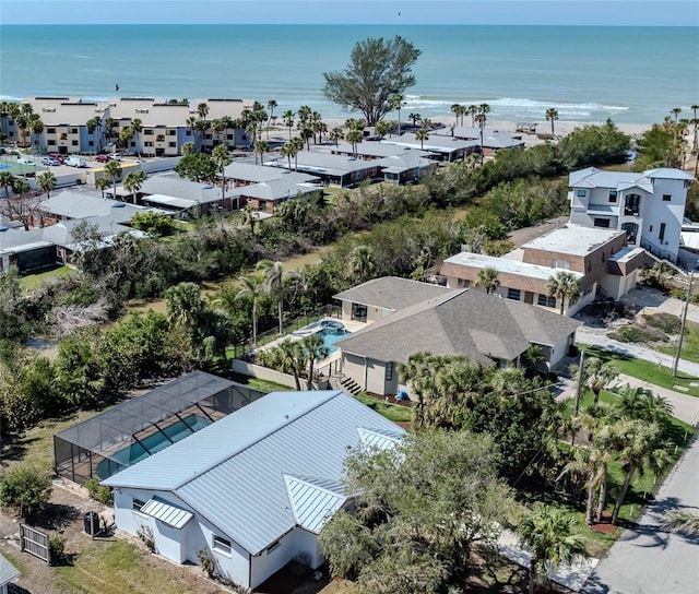 drone / aerial view featuring a residential view and a water view