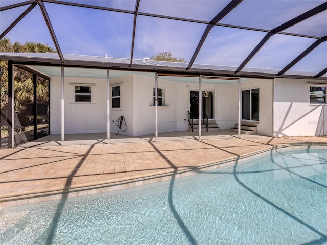 outdoor pool featuring entry steps, a patio, and a lanai