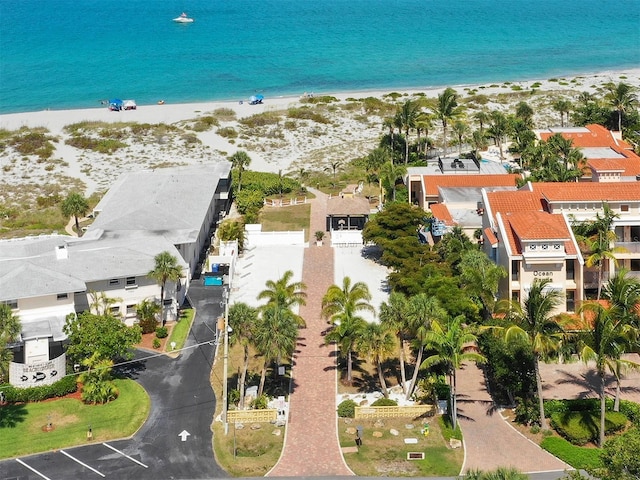 aerial view featuring a water view, a residential view, and a view of the beach