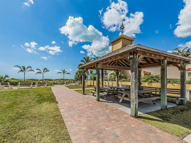 view of property's community with a gazebo and a lawn