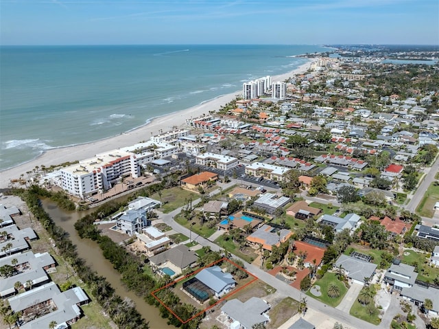 aerial view with a water view and a view of the beach