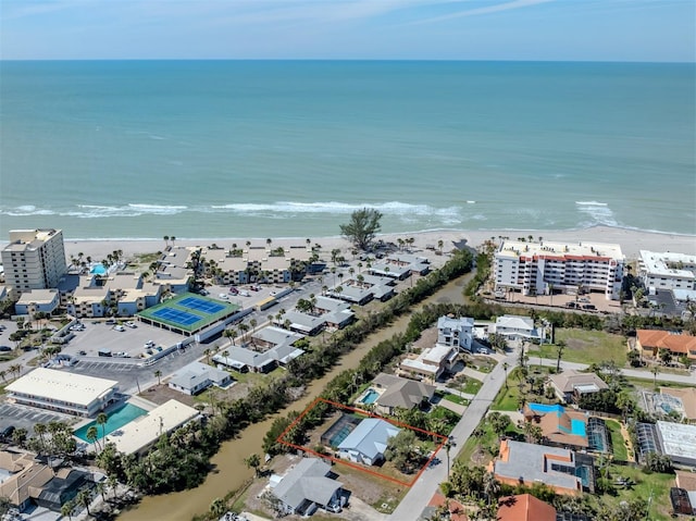 aerial view featuring a water view and a beach view