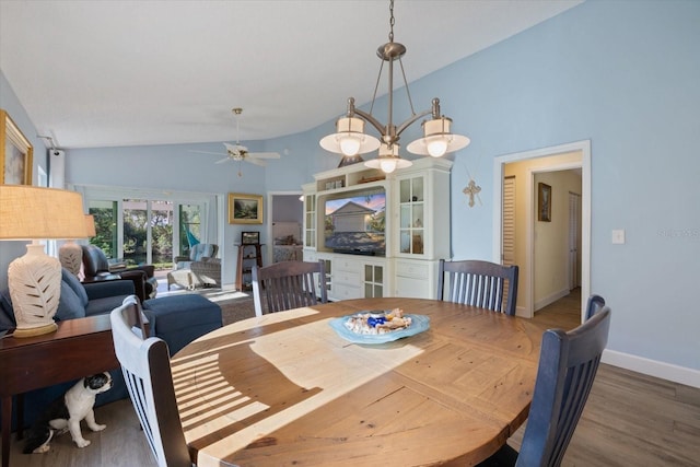 dining space with high vaulted ceiling, ceiling fan, baseboards, and wood finished floors