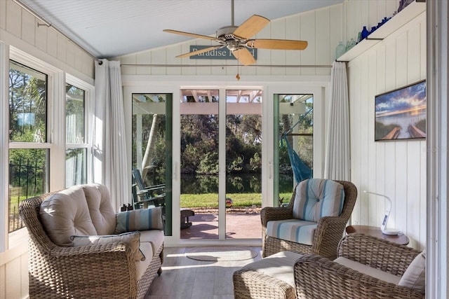 sunroom / solarium with vaulted ceiling and a ceiling fan