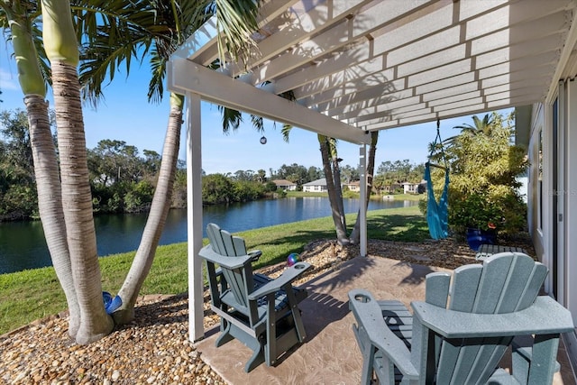 view of patio featuring a water view and a pergola