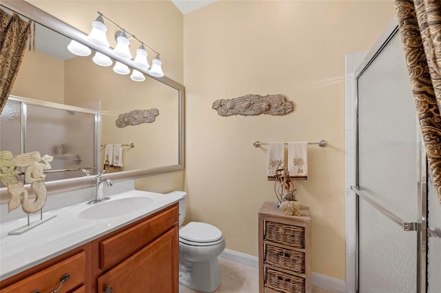 full bath with a stall shower, baseboards, toilet, tile patterned flooring, and vanity