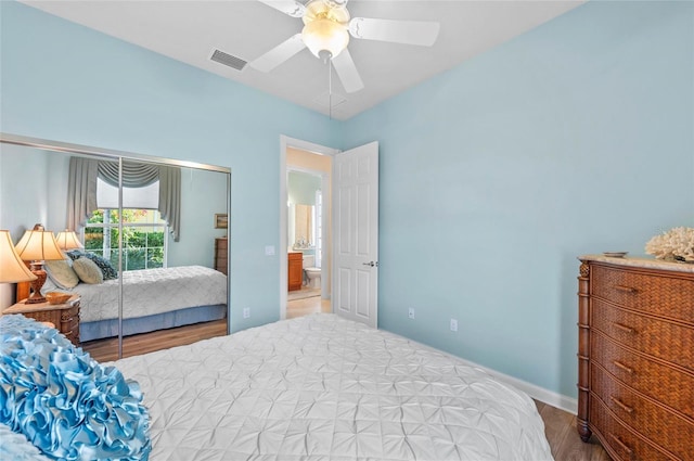 bedroom featuring ceiling fan, wood finished floors, visible vents, baseboards, and access to outside