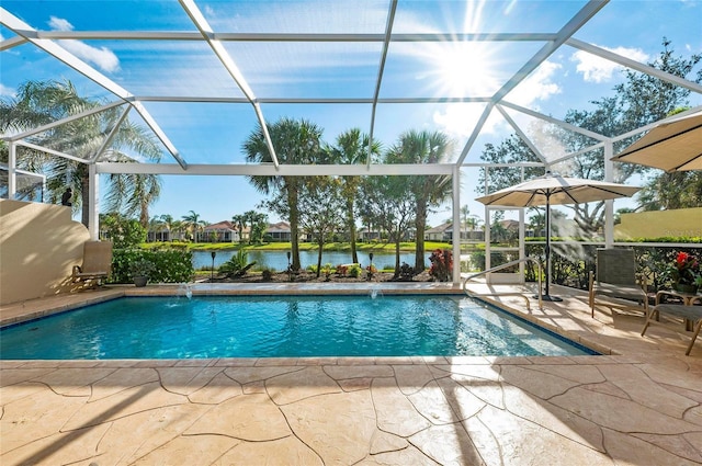 pool with a patio area, a lanai, and a water view