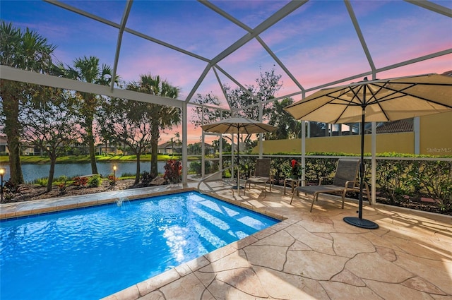 pool at dusk with a water view, a lanai, an outdoor pool, and a patio