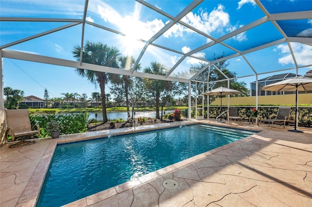 pool with a patio, a water view, and glass enclosure