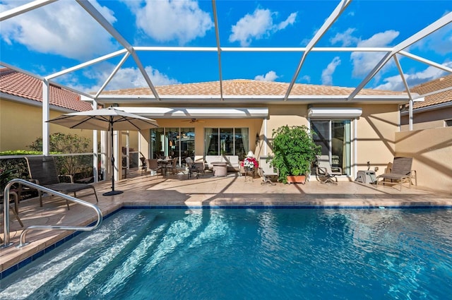 pool with ceiling fan, a patio area, a wall unit AC, and a lanai