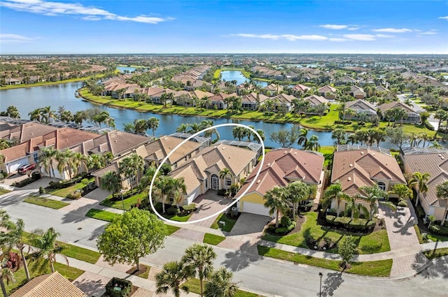 bird's eye view featuring a water view and a residential view