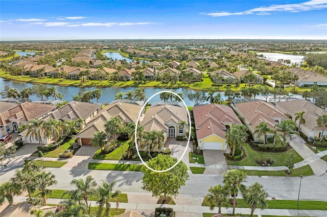 aerial view with a water view and a residential view