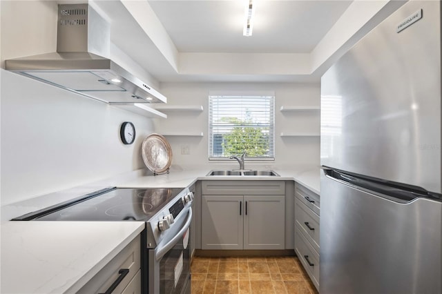 236 Harbor Dr S Unit 202, Venice, FL 34285 - kitchen with stainless steel appliances, ventilation hood, open shelves, and gray cabinets