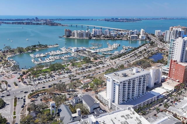 birds eye view of property with a view of city and a water view