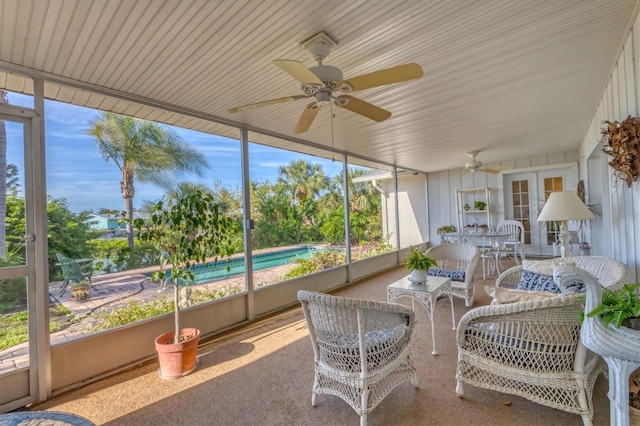 sunroom with ceiling fan and french doors
