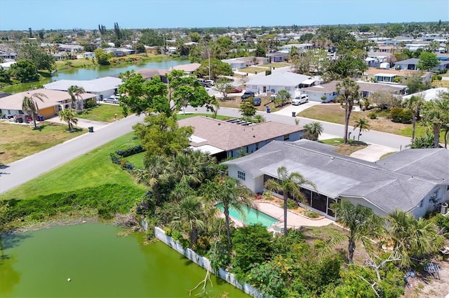 birds eye view of property with a residential view and a water view