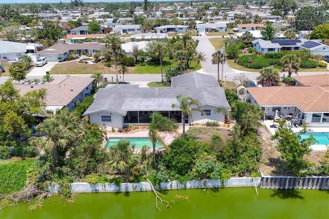 aerial view with a water view and a residential view
