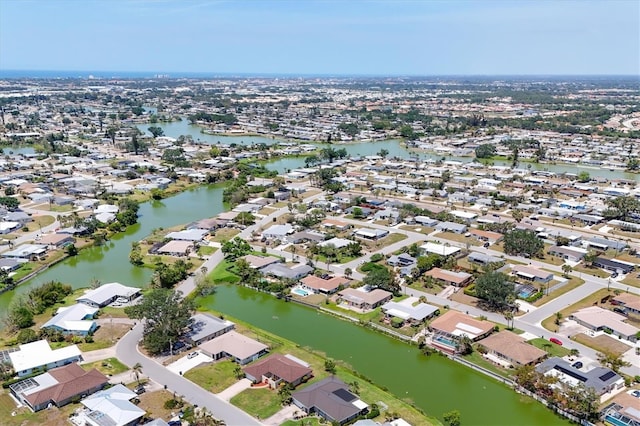 aerial view with a water view and a residential view