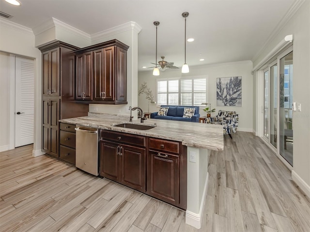 kitchen with ornamental molding, a peninsula, a sink, light wood-type flooring, and stainless steel dishwasher