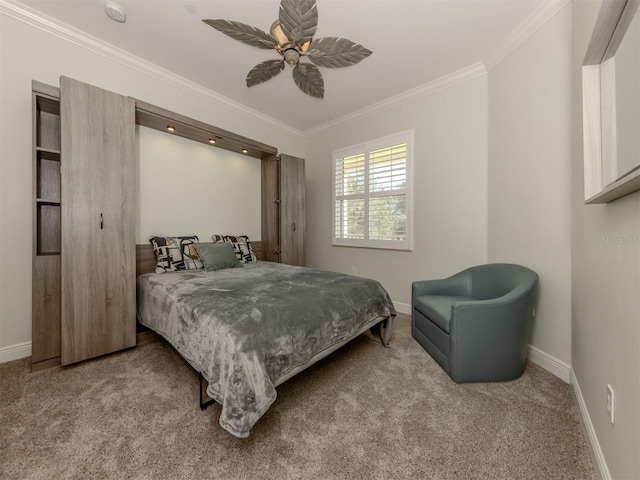 bedroom with a ceiling fan, carpet, ornamental molding, and baseboards