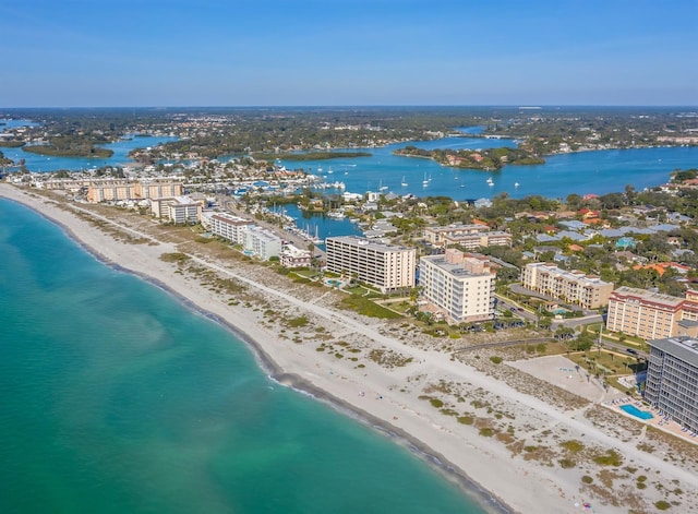 aerial view with a water view, a view of city, and a view of the beach