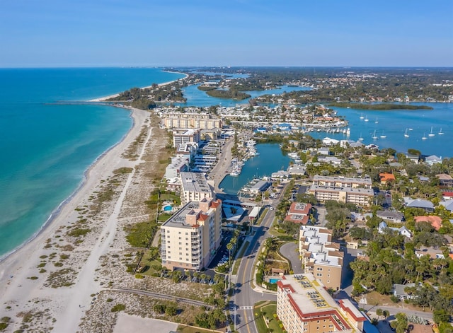 aerial view featuring a water view and a beach view