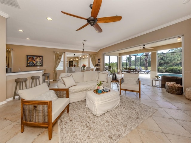 living room featuring visible vents, baseboards, a sunroom, ornamental molding, and recessed lighting