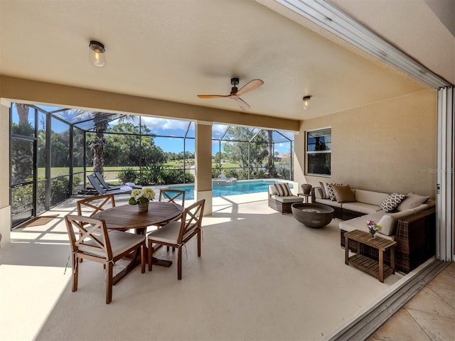 view of patio / terrace with ceiling fan, outdoor lounge area, a lanai, and an outdoor pool