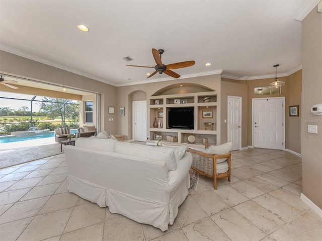 living room featuring visible vents, baseboards, a ceiling fan, crown molding, and built in shelves