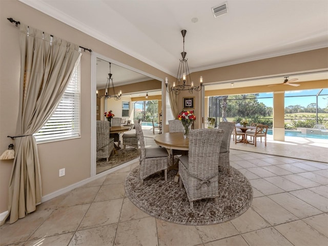 dining area featuring crown molding, baseboards, visible vents, and a notable chandelier