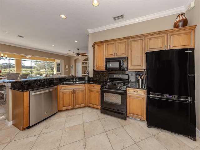 kitchen featuring a peninsula, visible vents, ornamental molding, backsplash, and black appliances