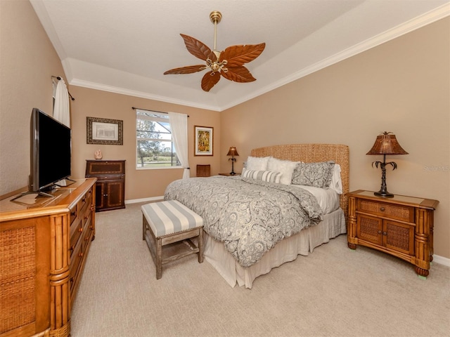 bedroom with ornamental molding, light carpet, and baseboards