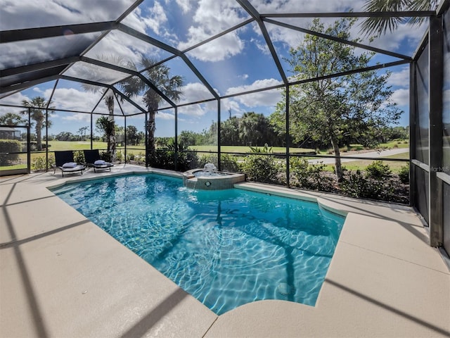 view of swimming pool featuring a lanai, a pool with connected hot tub, and a patio