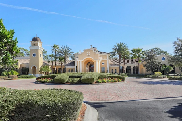 view of building exterior featuring decorative driveway