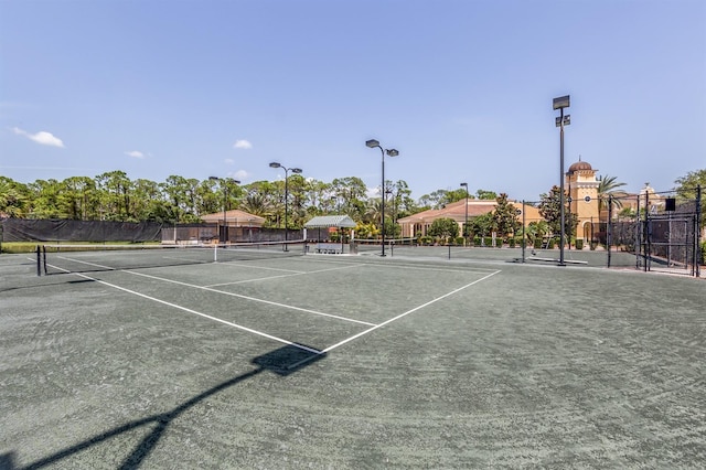 view of sport court with fence