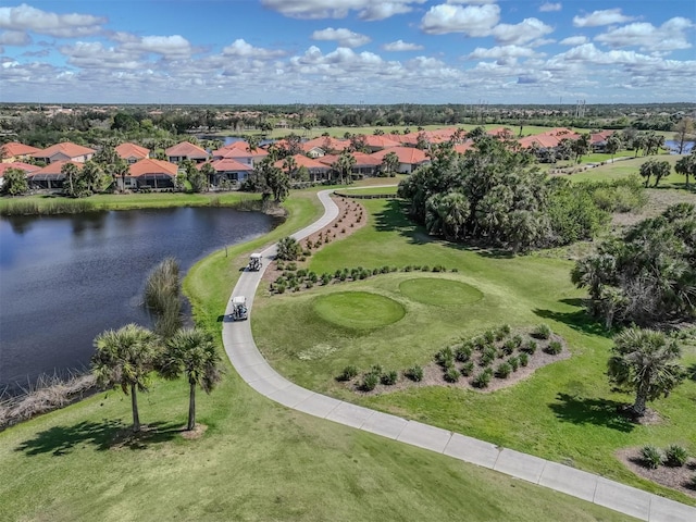 drone / aerial view featuring a water view and a residential view