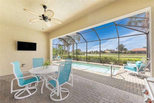 exterior space featuring a ceiling fan, a lanai, and a patio