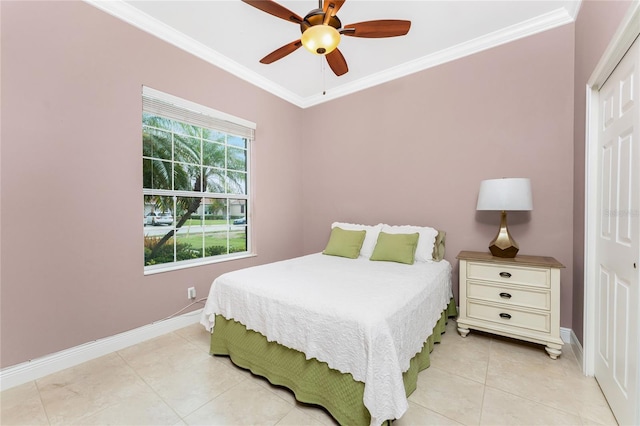 bedroom with baseboards, crown molding, and light tile patterned flooring