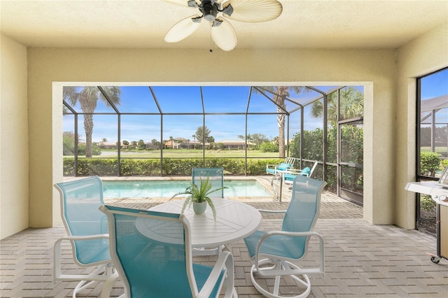 sunroom / solarium featuring a swimming pool