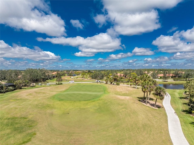 aerial view with view of golf course and a water view