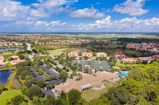 bird's eye view with a residential view and a water view