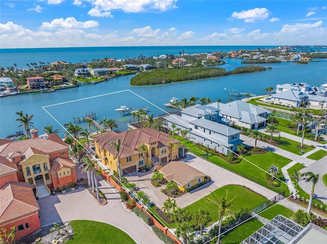 birds eye view of property with a residential view and a water view