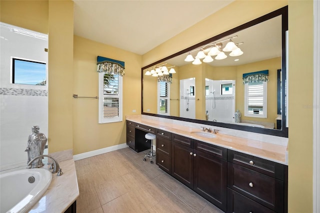 bathroom featuring a garden tub, baseboards, a walk in shower, and vanity