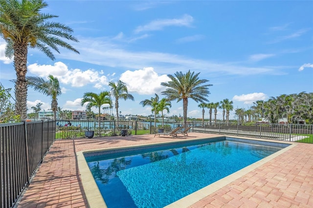 view of pool with a fenced in pool, a patio area, and fence