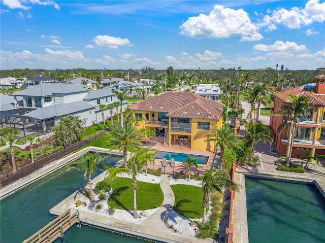 bird's eye view featuring a water view and a residential view