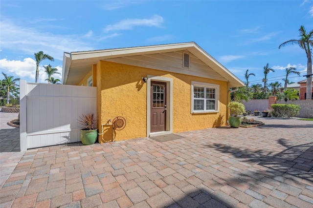 view of outbuilding with fence