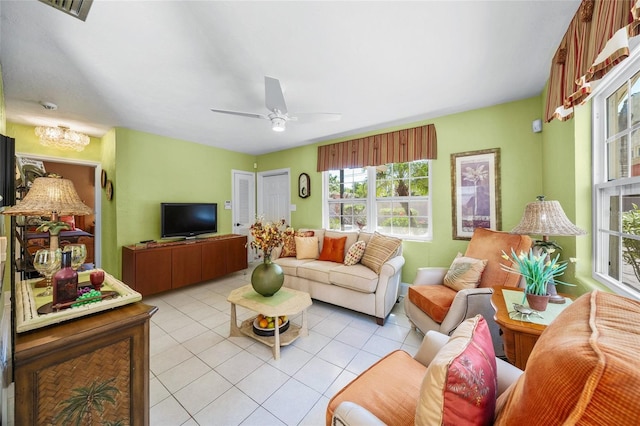 living area featuring visible vents, ceiling fan, and light tile patterned floors