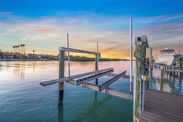 view of dock with a water view and boat lift